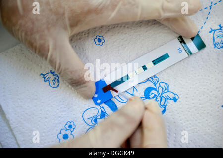 AIDS rapid test with a drop of blood that is taken from the fingertip, Masaya, Departamento Masaya, Nicaragua Stock Photo