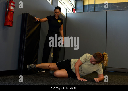 U.S. Air Force Airmen assigned to the 169th Fighter Wing at McEntire Joint National Guard Base, South Carolina Air National Guard, participate in a “females only” self-defense class provided by the Richland County Sherriff’s Department, Oct. 6, 2013.