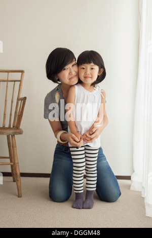 Mother and daughter smiling, portrait Stock Photo