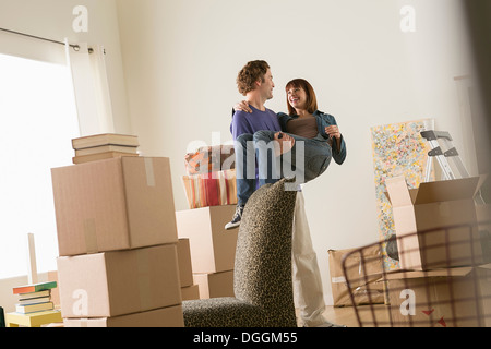 Couple having fun whilst moving Stock Photo