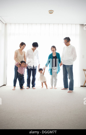 Three generation family holding hands, portrait Stock Photo