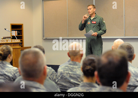 Oregon Air National Guard Col. Richard Wedan, 142nd Fighter Wing commander, addresses airmen of the 142nd Fighter Wing at the Portland Air National Guard Base, Ore., Oct. 8, 2013, during a town hall meeting to discuss the current conditions of the unit an Stock Photo