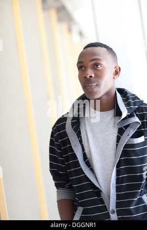 Eighteen year old student looking ahead in a college hallway. Stock Photo