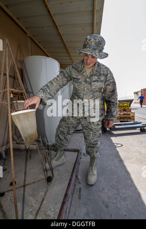 Senior Airman Jordan Hocker inspects for pests in the dining facility ...