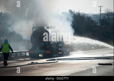 HGV Oil Tanker on Fire Motorway Hard Shoulder Stock Photo