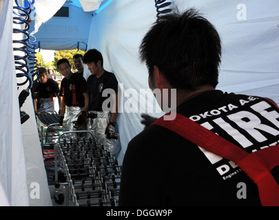 Firefighters from the 374th Civil Engineer Squadron set up a decontamination tent during an emergency management exercise Oct. 10, 2013, at Yokota Air Base, Japan. The training allowed first responders to practice their skills in responding to an emergenc Stock Photo