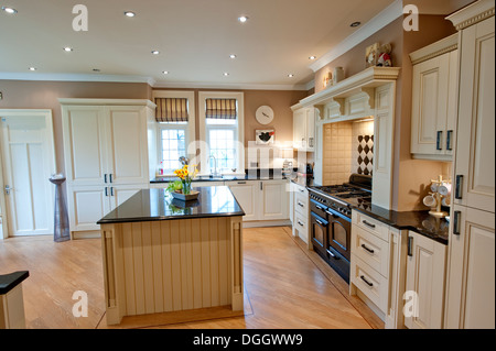 English country Kitchen Aga Wood Wooden island Stock Photo