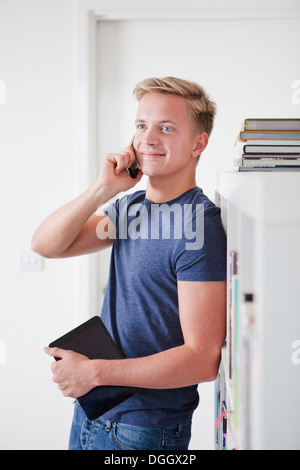Male student on cell phone Stock Photo