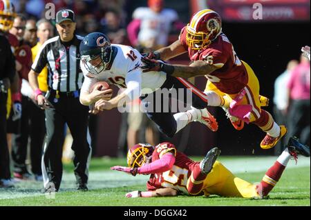 Landover, Maryland, USA. 21st Oct, 2013. OCT 20, 2013 : Chicago Bears quarterback Josh McCown (12) dives for the sideline as he gets hit by Washington Redskins inside linebacker Perry Riley (56) and Washington Redskins free safety David Amerson (39) during the matchup between the Chicago Bears and the Washington Redskins at FedEx Field in Landover, MD. © csm/Alamy Live News Stock Photo
