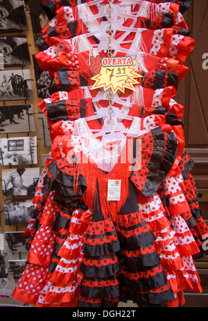 Pretty children's red flamenco dancer dresses on sale Malaga Spain Stock Photo