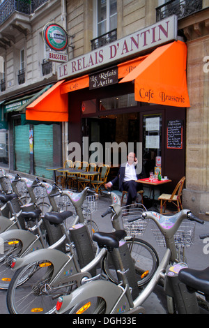 Paris France,9th arrondissement,Rue de la Victoire,Velib bike share station,restaurant restaurants food dining cafe cafes,cuisine,food,cafe,brasserie, Stock Photo