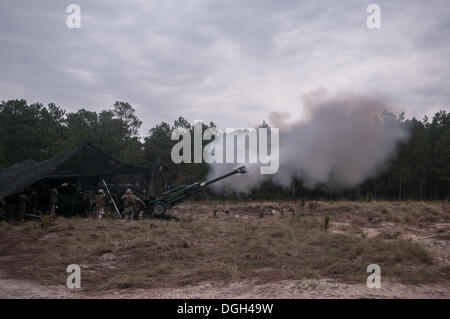 Fort Bragg, North Carolina, USA. 19th Oct, 2013. U.S. Marines from India Battery 3/10, 1st Battalion, 10th Marine Regiment, 2nd Marine Division from Camp Lejeune, N.C., fire their M777A2 155mm lightweight howitzer near Holland Drop Zone on Fort Bragg. The 10th Regiment is at Fort Bragg for their 'Rolling Thunder' biannual training. The training provides the Marines the ability hone their skills so they may be more effective in combat operations. © Timothy L. Hale/ZUMA Wire/ZUMAPRESS.com/Alamy Live News Stock Photo
