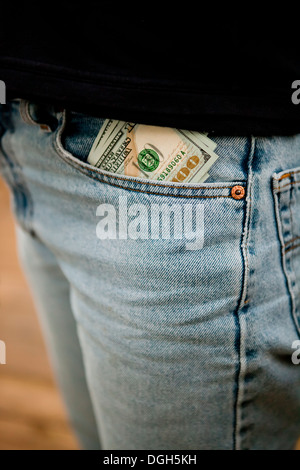 Money sticking out of pants front pocket Stock Photo
