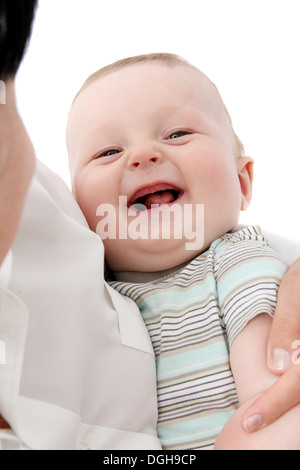 Happy baby in mother's hands Stock Photo