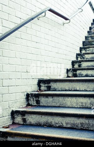 Stone steps and white wall in muted tones Stock Photo