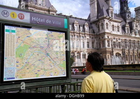 Paris France,4th arrondissement,Place de l'Hôtel de Ville,Metro Station,map,entrance,Line 1 11,man men male,looking,administration building,France1308