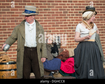 Actors at the Victorian festival of Christmas at Portsmouth Historic Dockyard interact and mingle with the public. Stock Photo