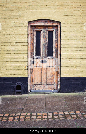 An old weathered front door to an english cottage Stock Photo