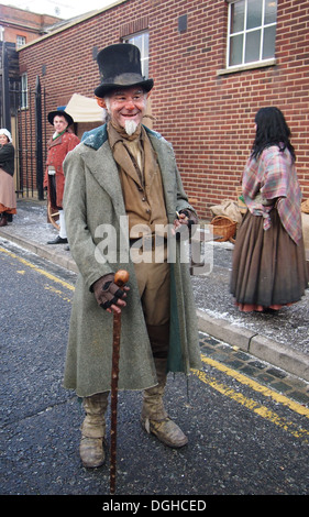 Actors at the Victorian festival of Christmas at Portsmouth Historic Dockyard interact and mingle with the public. Stock Photo