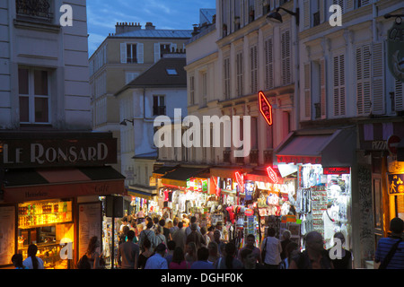 Paris France,18th arrondissement,Montmatre,Place Saint St. Pierre,Rue de Steinkerque,night evening,shopping shopper shoppers shop shops market markets Stock Photo