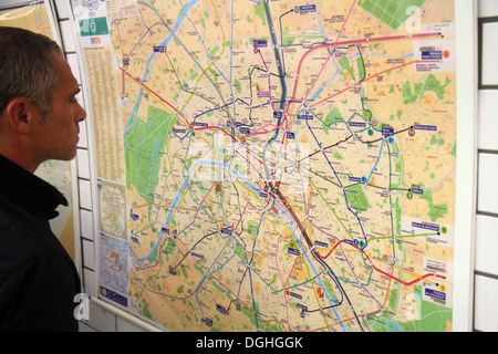 Paris France,9th 18th arrondissement,Pigalle Metro Station Line 2 12,subway,train,rider,passenger passengers rider riders,man men male,looking at,syst Stock Photo