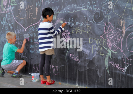 Paris France,Seine River,La Rive Gauche,Left Bank,Berges de Seine,teen teens teenager teenagers girl girls,child children,friends,drawing,giant chalkb Stock Photo