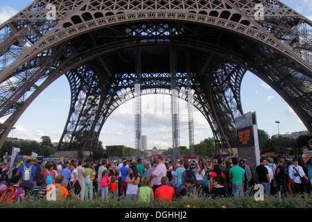 Paris France,7th arrondissement,Eiffel Tower,base,crowds,crowd,legs,pillars,France130819142 Stock Photo