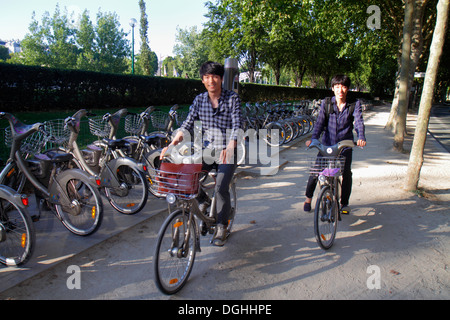 Paris France,7th arrondissement,Quai Branly,Velib bike share system,station,bicycle rental,Asian man men male,friends,couple,Korean,France130819164