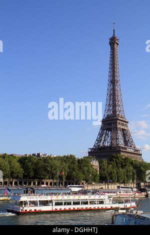 Paris France,Europe,French,Seine River water,Eiffel Tower,Bateau Mouche,cruise boat,Left Bank view,visitors travel traveling tour tourist tourism land Stock Photo