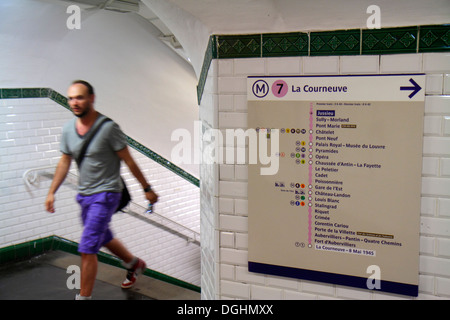 Paris France,5th arrondissement,Jussieu Metro Station Line 7,subway,train,rider,passenger passengers rider riders,man men male,sign,directions,station Stock Photo