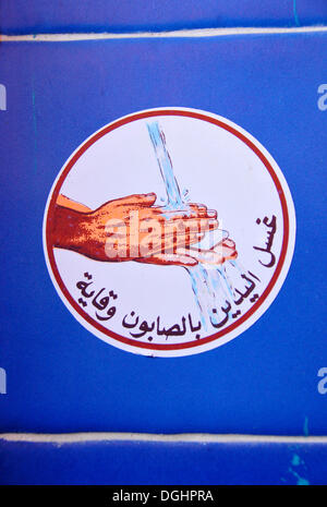 Sign 'do not forget to wash your hands' in a restaurant in Essaouira, Morocco, Africa Stock Photo