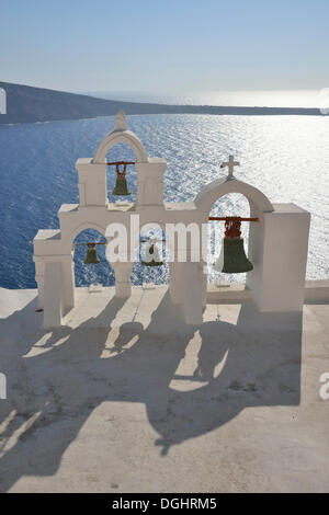 Bell tower in front of the Caldera, Oía, Santorin, Cyclades, Greece Stock Photo