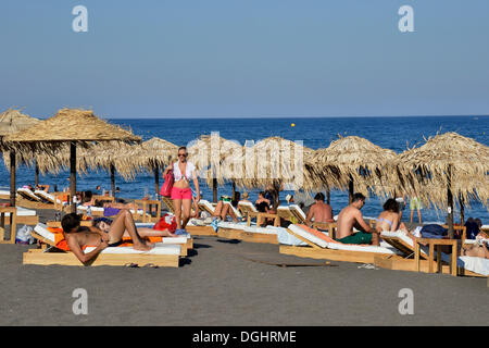 Tourists on Perívolos Beach near Perivolos, Perívolos, Santorin, Cyclades, Greece Stock Photo