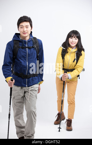 a couple wearing hiking gear Stock Photo