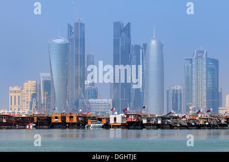 Dhows in front of the skyline of New Town business district, Doha, Qatar, Middle East Stock Photo