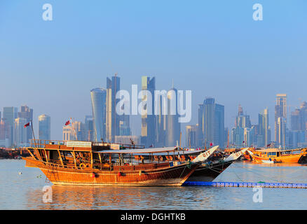 Dhows in front of the skyline of the West Bay area, business district, Doha, Qatar, Middle East Stock Photo