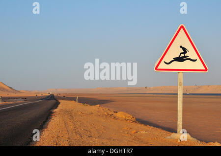 Road sign 'Caution Surfers' at the Rio de Oro Bay, Westsahara, bei Dakhla, Oued Ed-Dahab-Lagouira region, Morocco Stock Photo