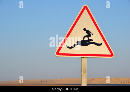 Road sign 'Caution Surfers' at the Rio de Oro Bay, Westsahara, bei Dakhla, Oued Ed-Dahab-Lagouira region, Morocco Stock Photo