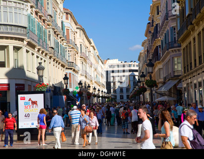People shopping on street city centre Malaga Spain Stock Photo