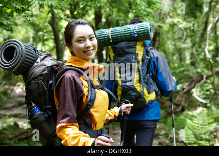 a couple hiking in the woods Stock Photo