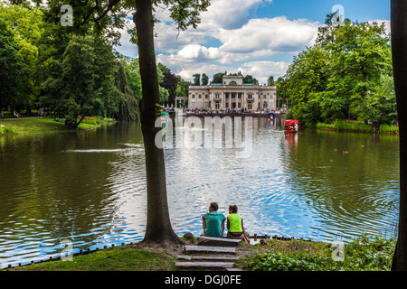 A summer day by the lake in Lazienki Park in Warsaw with the Palace in the distance. Stock Photo