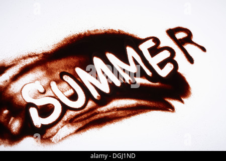 the word summer written in sand Stock Photo