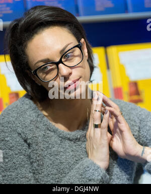 Frankfurt, Germany. 10th Oct, 2013. Lilly Becker follows the book presentation of her husband Boris Becker at the Book Fair in Frankfurt, Germany, 10 October 2013. Becker present his biography 'Das Leben ist kein Spiel'. The Frankfurt Book Fair lasts until 13 October, around 250 000 visitors are expected. Photo: BORIS ROESSLER/dpa/Alamy Live News Stock Photo