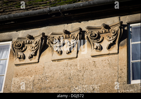 Decorative details on upper front wall of a stone cottage in Lacock village UK Stock Photo