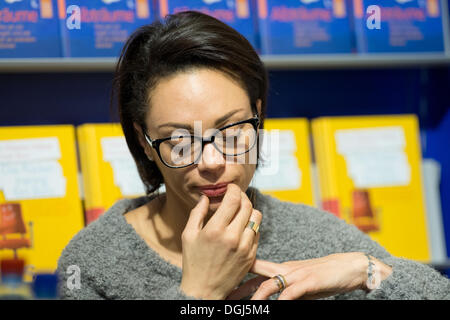 Frankfurt, Germany. 10th Oct, 2013. Lilly Becker follows the book presentation of her husband Boris Becker at the Book Fair in Frankfurt, Germany, 10 October 2013. Becker present his biography 'Das Leben ist kein Spiel'. The Frankfurt Book Fair lasts until 13 October, around 250 000 visitors are expected. Photo: BORIS ROESSLER/dpa/Alamy Live News Stock Photo