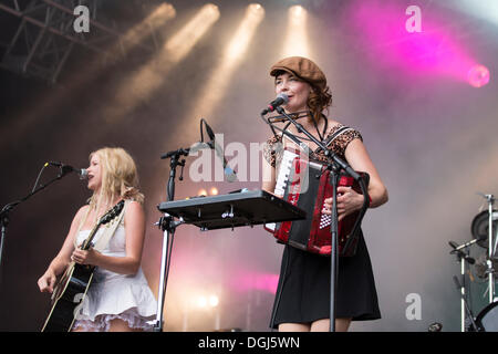 Solveig Heilo with a guitar and Anne Marit Bergheim with an accordion from the Norwegian girl band Katzenjammer performing live Stock Photo