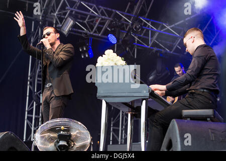 Singer Theo Hutchcraft and pianist Adam Anderson from the British synth-pop band Hurts performing live at Heitere Open Air in Stock Photo