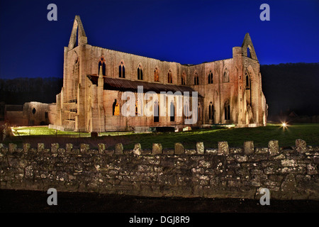 A view of Tintern Abbey illuminated at night. Stock Photo