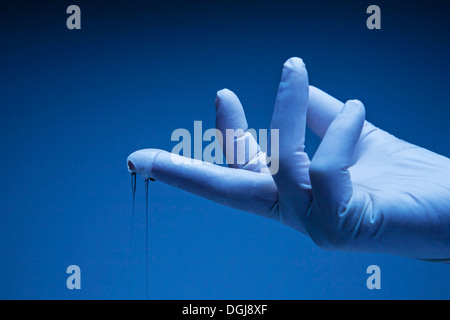 Latex gloved hand. Stock Photo