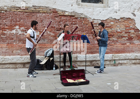 Music students busking in the Accademia district of Venice. Stock Photo